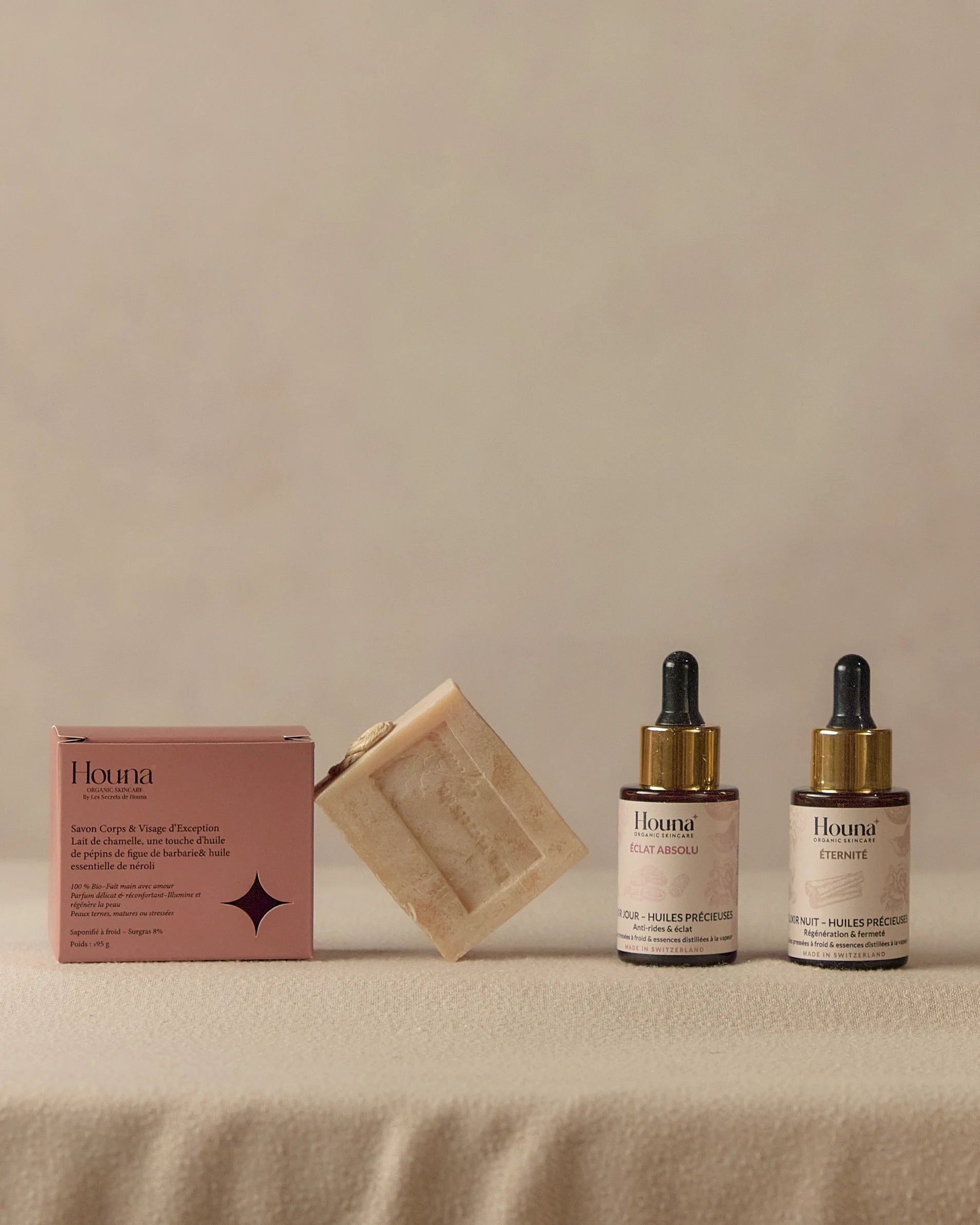 Routine visage Le Rituel Houna - sérum jour ÉCLAT ABSOLU, sérum nuit ÉTERNITÉ et savon artisanal saponifié à froid, soins naturels suisses pour peau éclatante